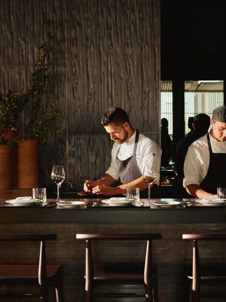 Chef and bar staff working together at a Perth hospitality venue